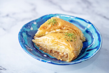 Turkish delight. Baklava and coconut lukum with cups of coffee