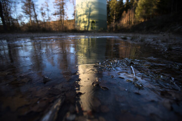 a modern wind turbine in the evening ice reflection