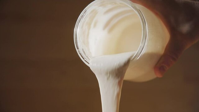 SOURDOUGH starter is poured from its jar for baking