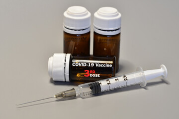 Syringe with Covid-19 Vaccine Booster Dose. Fight against virus covid-19 coronavirus, Vaccination...