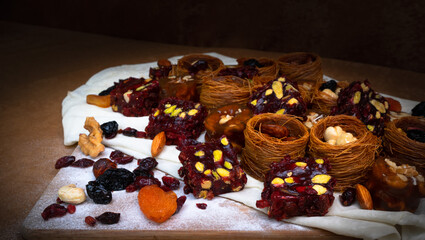 Traditional multi-colored arabic sweets baklava, lokum, muska pestili and nuts assortment. Top view.