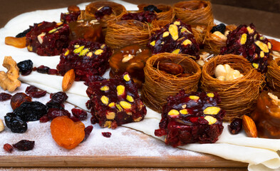 Traditional multi-colored arabic sweets baklava, lokum, muska pestili and nuts assortment. Top view.