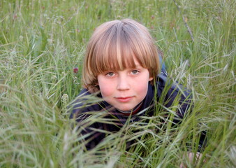 portrait of a boy in grass