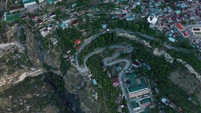Gunib village in Dagestan. Aerial view of mountainous landscape Dagestan aul Gunib and nearby mountains, famous landmark. Ancient settlement. Travel in Russia. 10 bit Video