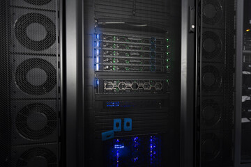 Data Center With Multiple Rows of Fully Operational Server Racks. Modern Telecommunications, Cloud Computing, Artificial Intelligence, Database, Supercomputer Technology Concept.