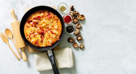 Pizza,Delicious pepperoni pizza and basil tomato cooking ingredients on black concrete background, top view of hot pepperoni pizza. With copy space for text lay flat, banner