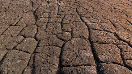 Grand canyon surface,Grungy cragged bumpy pitted cavity stone facade, split layer gap.Ruined cracked shattered worn rough hiking canyon.Old ragged grunge steep marble cliff. Grand vintage crannied dam