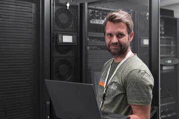 Data Center Engineer Using Laptop Computer Server Room Specialist Facility with Male System...