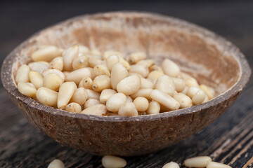 dried cedar nuts on a wooden table