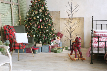 Elegant Christmas tree and fireplace with gifts decorated for Christmas in apartments with gray walls