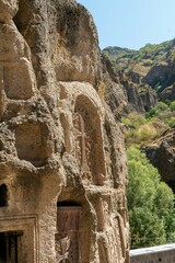 Naklejka premium Armenia, Geghard, September 2021. Religious symbols carved into the rock.