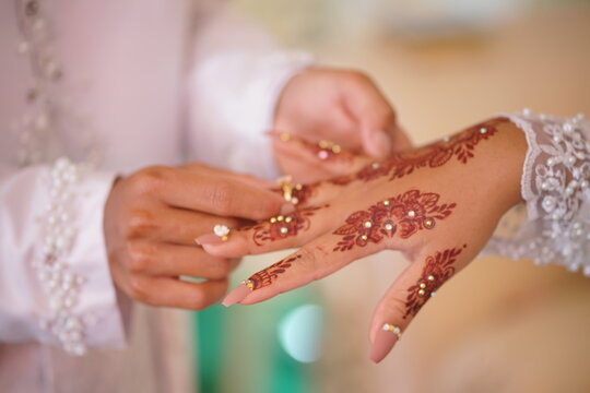 traditional wedding, bridal showing henna design and hand jewellery