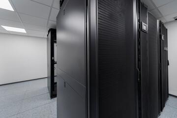 Data Center With Multiple Rows of Fully Operational Server Racks. Modern Telecommunications, Cloud Computing, Artificial Intelligence, Database, Supercomputer Technology Concept.