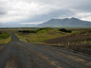 Unpaved dirt road leading to historic Keldur farmhouse in Southern Iceland