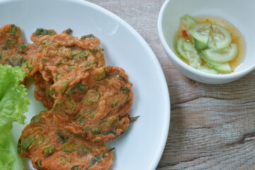 fried fish patty on plate dipping sweet chili sauce