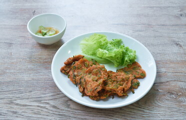 fried fish patty on plate dipping sweet chili sauce
