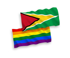 National vector fabric wave flags of Co-operative Republic of Guyana and Rainbow gay pride isolated on white background. 1 to 2 proportion.