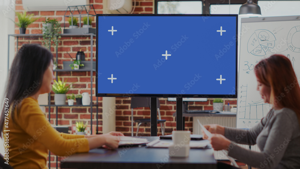 Poster team of colleagues looking at mockup template on monitor, using blank chroma key with isolated backg