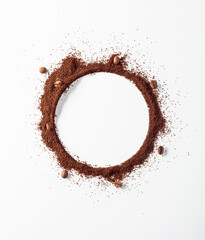 Coffee beans and coffee powder with round copy space.