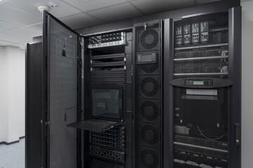 Obraz premium Data Center With Multiple Rows of Fully Operational Server Racks. Modern Telecommunications, Cloud Computing, Artificial Intelligence, Database, Supercomputer Technology Concept.