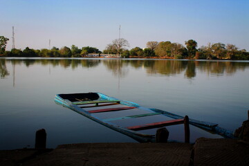 A rowing boat submerged in the Gambia River