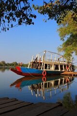 Fototapeta na wymiar A riverboat on the Gambia river, in a portrait photo