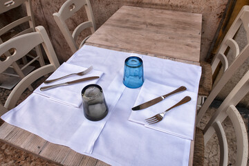 Kitchen utensils-wooden spoons and cutting boards on table close up. kitchen utensils close-up in...