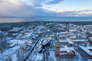 Aerial winter sunny frozen day view of snowy resort Palanga, Lithuania