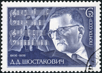 USSR - 1976: shows portrait of Dmitri Dmitriyevich Shostakovich (1906-1975), composer, Score from 7th Symphony, Leningrad, 1976 - 477463458