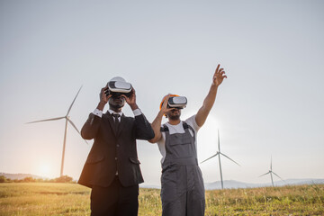 African american businessman and indian engineer wearing VR headset during meeting on farm with...