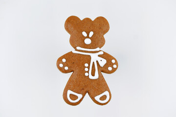 Cute gingerbread bear decorated with white icing, copy space
