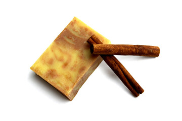top view of various handcrafted soap with different ingredients in row on white surface.