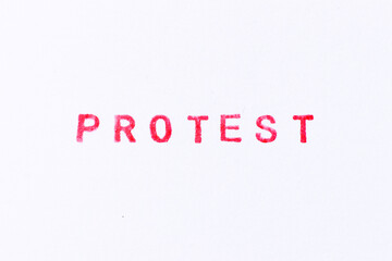 Red color ink rubber stamp in word protest on white paper background