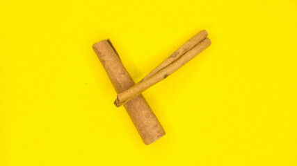 
Cinnamon, photo on a yellow background