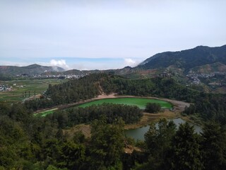 see the view of the lake from the top of the hill