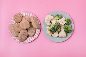 Frozen Ground Meat Cutlets and Frozen Vegetable on Plate Pink Background Frozen Semi Finished Products Horizontal Top View