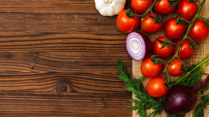 fragrant tomatoes on a wooden table. cherry tomatoes. top view. copy space.