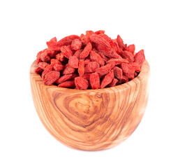 Chinese wolfberries in olive bowl, isolated on white background. Heap of dried goji berry.