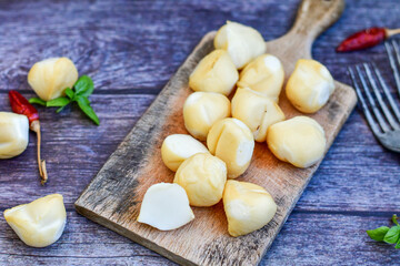  Smoked mini  traditional italian provola  cheese  on wooden background