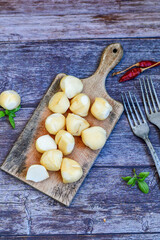  Smoked mini  traditional italian provola  cheese  on wooden background