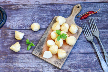  Smoked mini  traditional italian provola  cheese  on wooden background