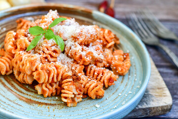  Home made italian   radiatori bolognese fresh   pasta  on rustic background. Mediterranean food concept