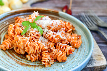 Home made italian   radiatori bolognese fresh   pasta  on rustic background. Mediterranean food...