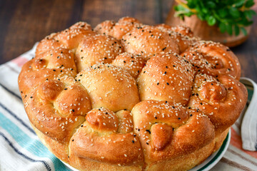 Close-up of fresh  traditional  artisan homemade round  bread . Bulgarian tradional holiday bread
