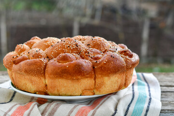 Close-up of fresh  traditional  artisan homemade round  bread . Bulgarian tradional holiday bread