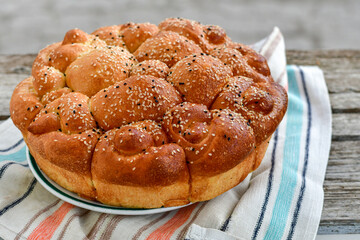Close-up of fresh  traditional  artisan homemade round  bread . Bulgarian tradional holiday bread