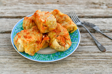Cabbage rolls with meat, rice and vegetables. Stuffed cabbage leaves with  ground beef. Known as sarma, golubtsy, dolma.