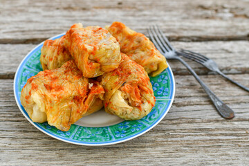 Cabbage rolls with meat, rice and vegetables. Stuffed cabbage leaves with  ground beef. Known as sarma, golubtsy, dolma.