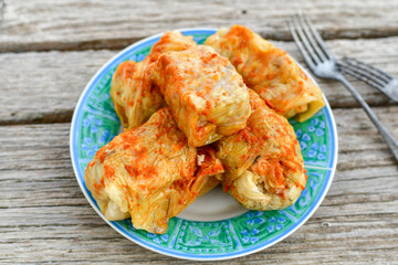 Cabbage rolls with meat, rice and vegetables. Stuffed cabbage leaves with  ground beef. Known as sarma, golubtsy, dolma.