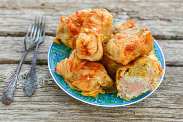 Cabbage rolls with meat, rice and vegetables. Stuffed cabbage leaves with  ground beef. Known as sarma, golubtsy, dolma.
